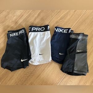 4 pairs of Nike Pro spandex